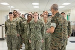 U.S. Navy Rear Adm. Guido Valdez, medical officer of the Marine Corps, addresses U.S. Navy Hospital Corpsman 3rd Class Hailey Arp during a visit to Naval Branch Health Clinic Marine Corps Recruit Depot San Diego, Aug. 14. Valdez presented Arp with a Navy and Marine Corps Achievement Medal for decisive actions that helped save the life of a Marine recruit during a field training event. NBHC MCRDSD is a branch of Naval Medical Center San Diego. NMCSD employs more than 5,500 active-duty military personnel, civilians, and contractors in southern California to deliver exceptional care afloat and ashore. (U.S. Marine Corps photo by Lance Cpl. Janell B. Valerio Alvarez)