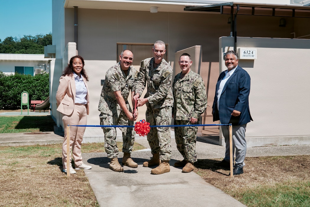 IKEGO HILLS FAMILY HOUSING AREA, Japan (July 29, 2026) -- Commander, Fleet Activities Yokosuka, Capt. Jonathan Hopkins, (second from left) cuts a ceremonial ribbon with Cmdr. Andrew Cotherman, Fleet Activities Yokosuka public works officer, alongside Lt. Cmdr. Jesse Crider, Fleet Activities Yokosuka port operations officer, Momo Harris, Fleet Activities Yokosuka Fleet and Family Readiness Director, and Esteban Abreu, Fleet Activities Yokosuka Navy Housing Director, outside a Family Townhome Unit at the installation’s Ikego Hills Family Housing Area in Zushi, Japan July 29, 2026. The ribbon-cutting celebrates the Phase 4 completion of Ikego Hills' five-phase $220 million revitalization project overhauling and renovating 356 family housing units and utilities. Ongoing work in Ikego Hills includes a new multipurpose community support center that will also feature an indoor pool, fitness facility, Child Development Center, modernized Navy Exchange facility, and ground parking for 115 privately-owned vehicles; a new School Age Care Center with spaces to operate both youth and teen programs, two new Public Works shops including permanent parking for school buses, and a significantly larger fire station set to house as many as six fire fighting vehicles of varying classes. (U.S. Navy photo by James Kimber)