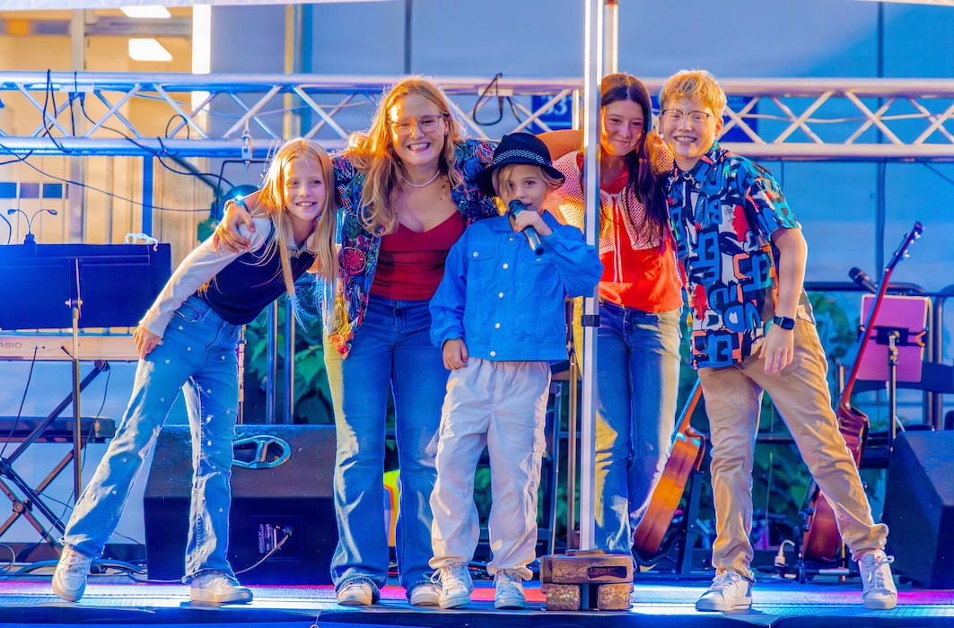 YOKOSUKA, Japan (Aug. 15, 2026) – A group of young performers poses on stage during a lip-sync battle at the annual Back-to-School Bash hosted by Commander Fleet Activities Yokosuka (CFAY) Morale, Welfare and Recreation and the Yokosuka Navy Exchange. The community event brought military families together to celebrate the upcoming school year with live entertainment, games and youth activities. CFAY provides, maintains and operates base facilities and services in support of the U.S. 7th Fleet's forward-deployed naval forces, 71 tenant commands and more than 27,000 military and civilian personnel and their families. (U.S. Navy photo by Sheryl Sullivan)