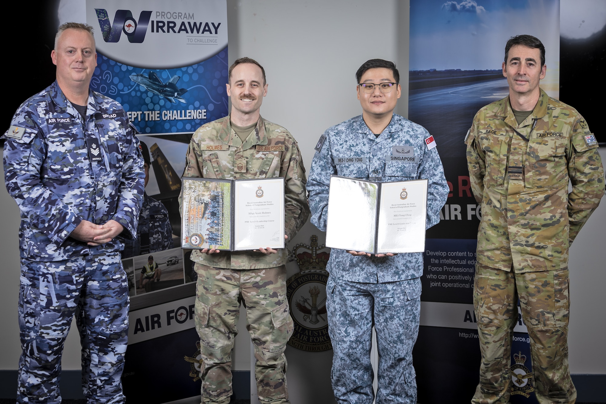 Airmen pose for a photo.