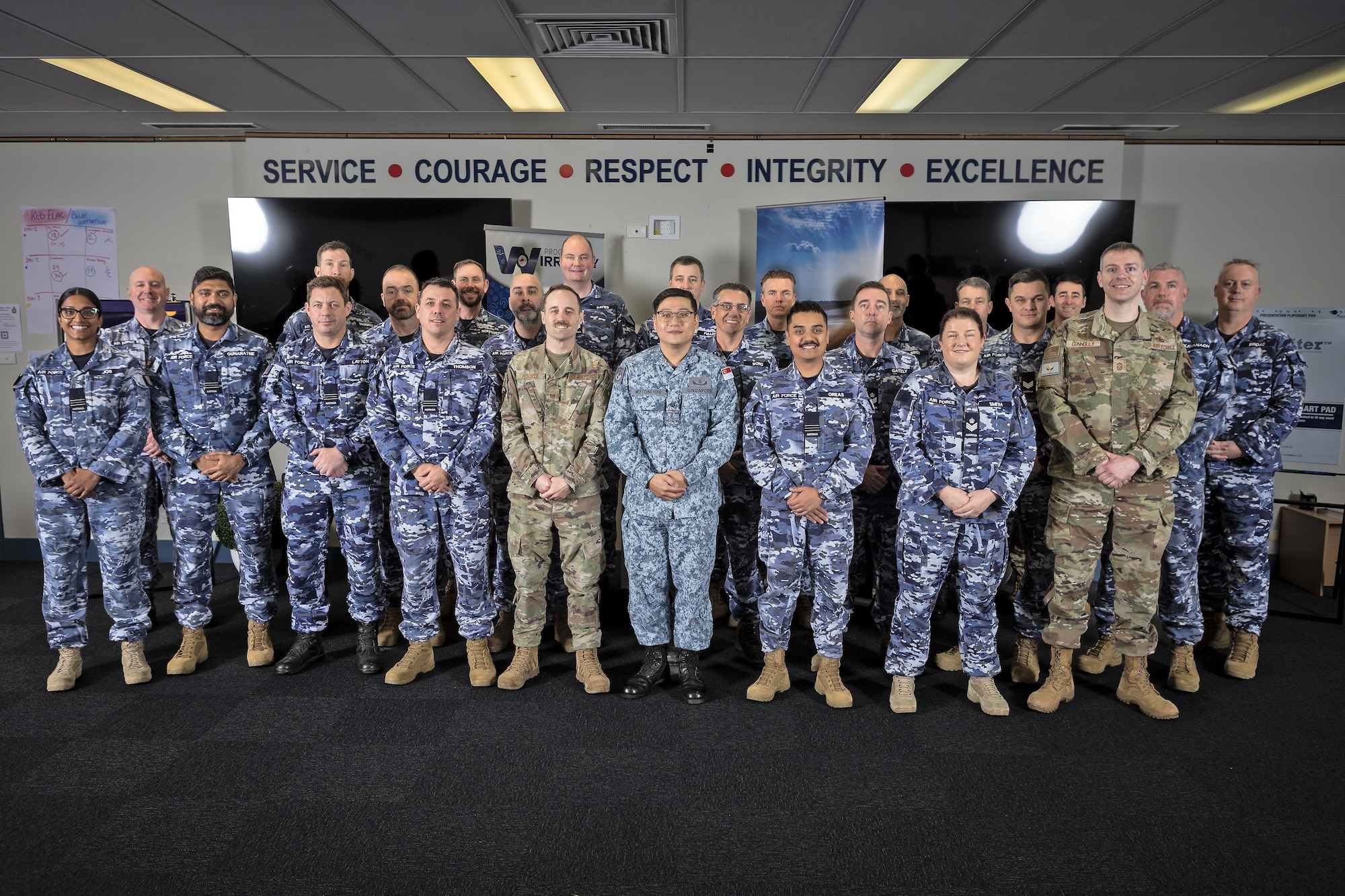 Airmen pose for a photo.