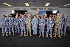 Airmen pose for a photo.