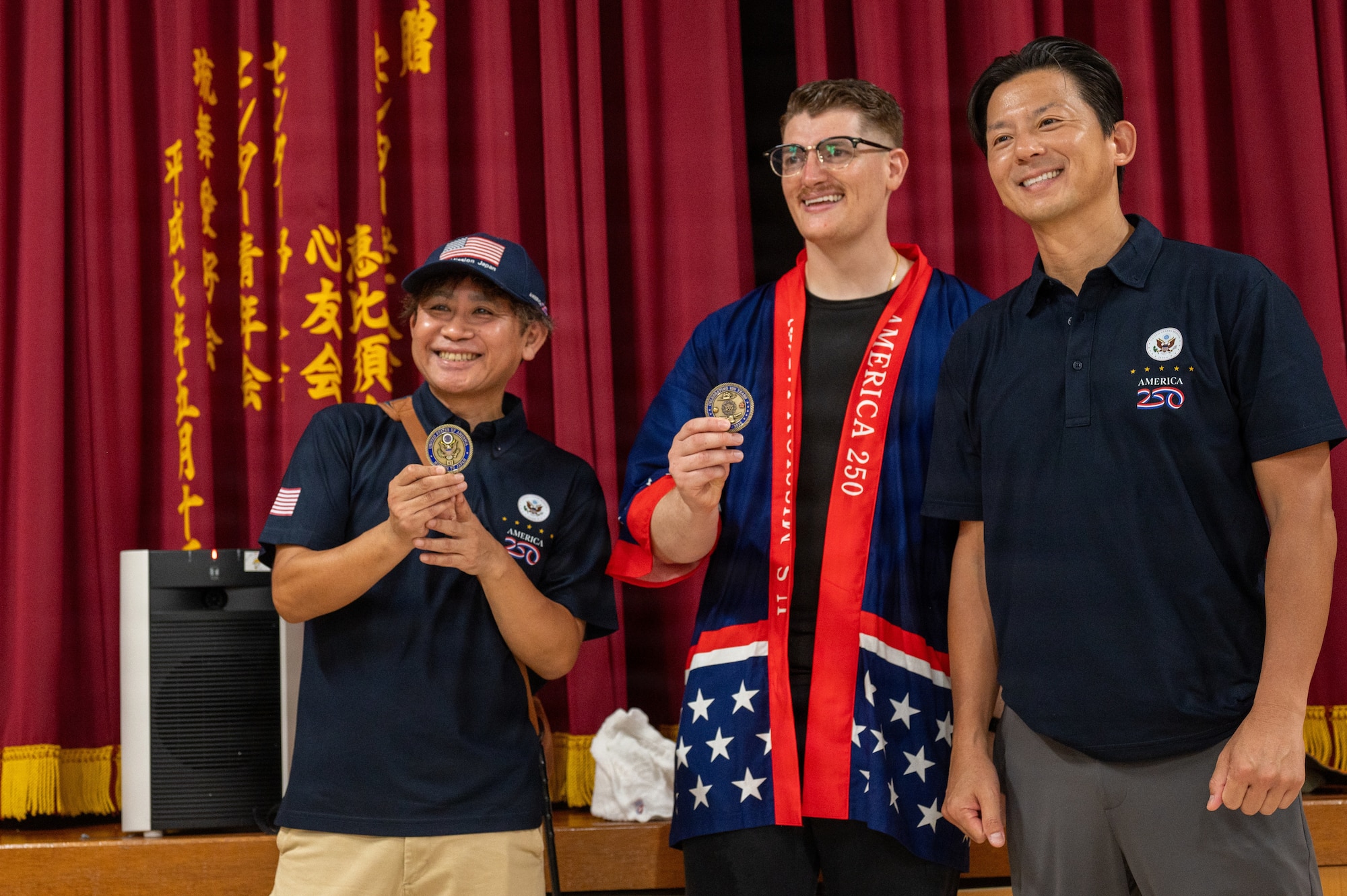 Service member and local presented with a coin.