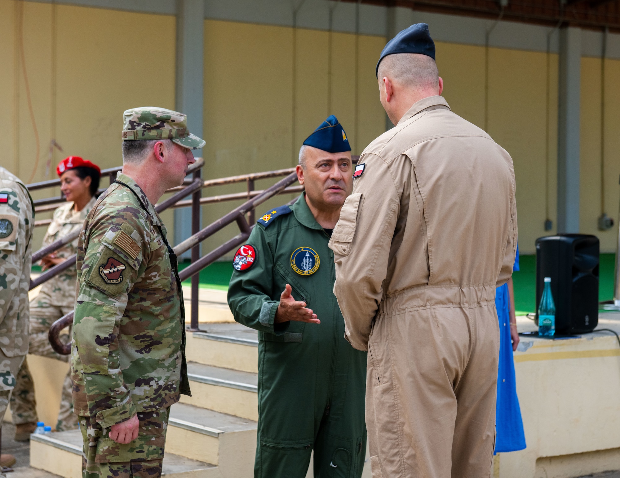 Turkish air force Brig. Gen. Kemel Güleç, center, 10th Main Jet Base Command commander, speaks with U.S Air Force Col. Isaac Adams, 39th Air Base Wing commander, and Polish Lt. Col. Arkadiusz Wirkus, Polish Military Contingent commander.