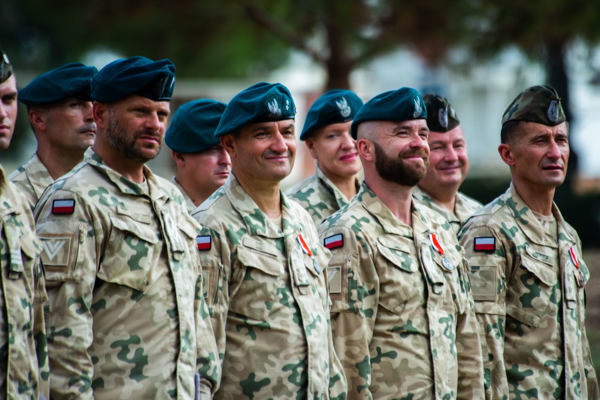Members assigned to the Polish Military Contingent stand in formation