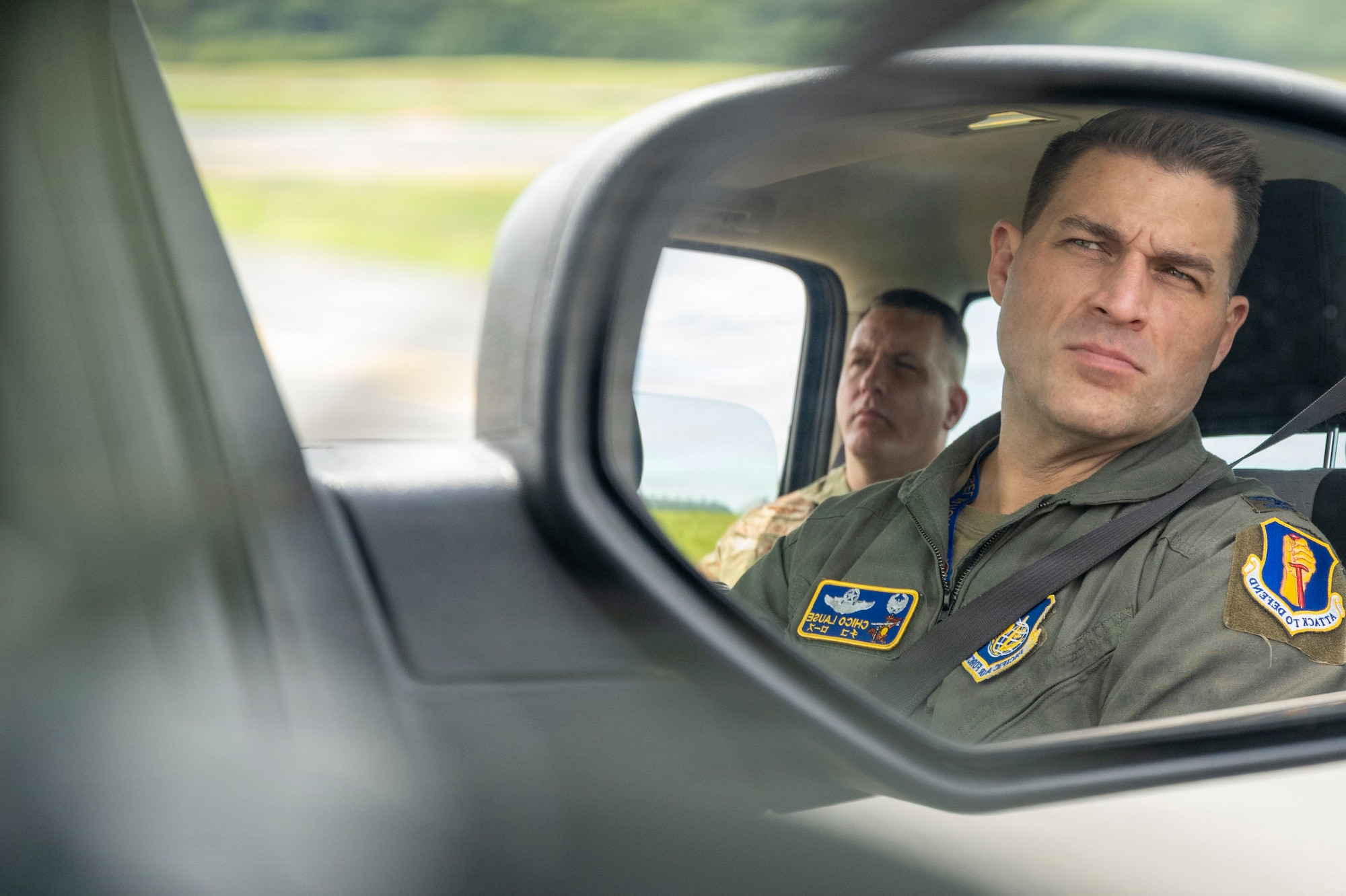 U.S. Air Force Col. Oliver Lause, 35th Fighter Wing commander, and Chief Master Sgt. Jason Amaxopulos, 35th Fighter Wing command chief, observes airfield conditions during a Bird/Wildlife Aircraft Strike Hazard Program ride-along as part of a Wild Weasel Walkthrough at Misawa Air Base, Japan, Aug. 18, 2026.