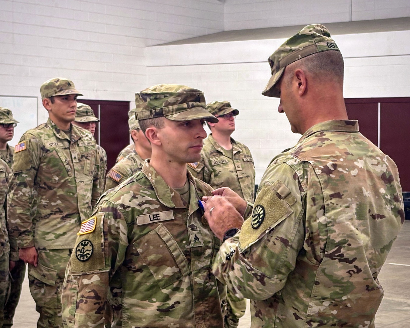 U.S. Army Brig. Gen. Trenton J. Gibson, adjutant general of the Montana National Guard, presents the Soldier’s Medal to U.S. Army Sgt. Adam M. Lee during a ceremony at the Belgrade Armory in Belgrade, Mont., Aug. 16.