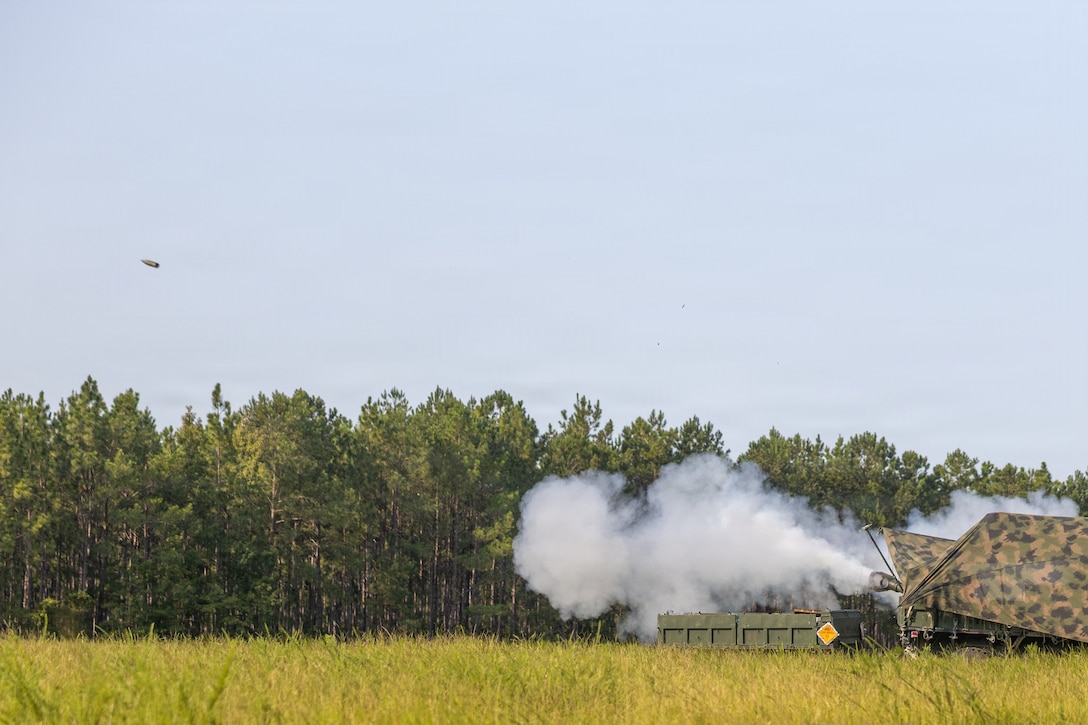 An M777 Howitzer assigned to Golf Battery, 2nd Battalion, 10th Marine Regiment, 2nd Marine Division, fires M795 155mm ammunition during an artillery operation in support of Burmese Chase 26 on Marine Corps Base Camp Lejeune, North Carolina, Aug. 11, 2026. Burmese Chase is an annual U.S. led, multi-lateral training exercise comprised of integrating ground and air fires, infantry tactics and naval gunfire alongside NATO allies to enhance combat readiness and interoperability. (U.S. Marine Corps photo by Lance Cpl. Dorian Melrath)