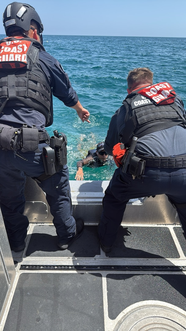 A U.S. Coast Guard Station Miami Beach boat crew rescues one mariner, Monday, after their personal watercraft began taking on water near Government Cut. Coast Guard Sector Miami watchstanders received notification from Miami-Dade dispatch at approximately 2:30 p.m. reporting a green and white personal watercraft taking on water with two people aboard.
