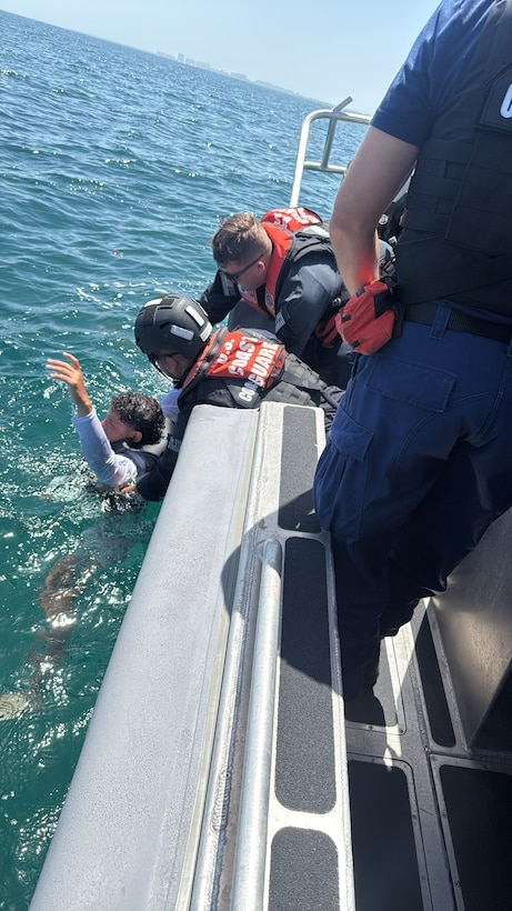 A U.S. Coast Guard Station Miami Beach boat crew rescues a mariner, Monday, after their personal watercraft began taking on water near Government Cut. Coast Guard Sector Miami watchstanders received notification from Miami-Dade dispatch at approximately 2:30 p.m. reporting a green and white personal watercraft taking on water with two people aboard.