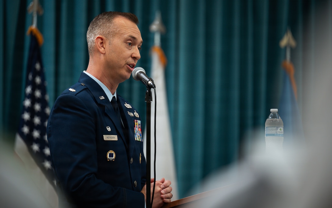 man speaking at podium