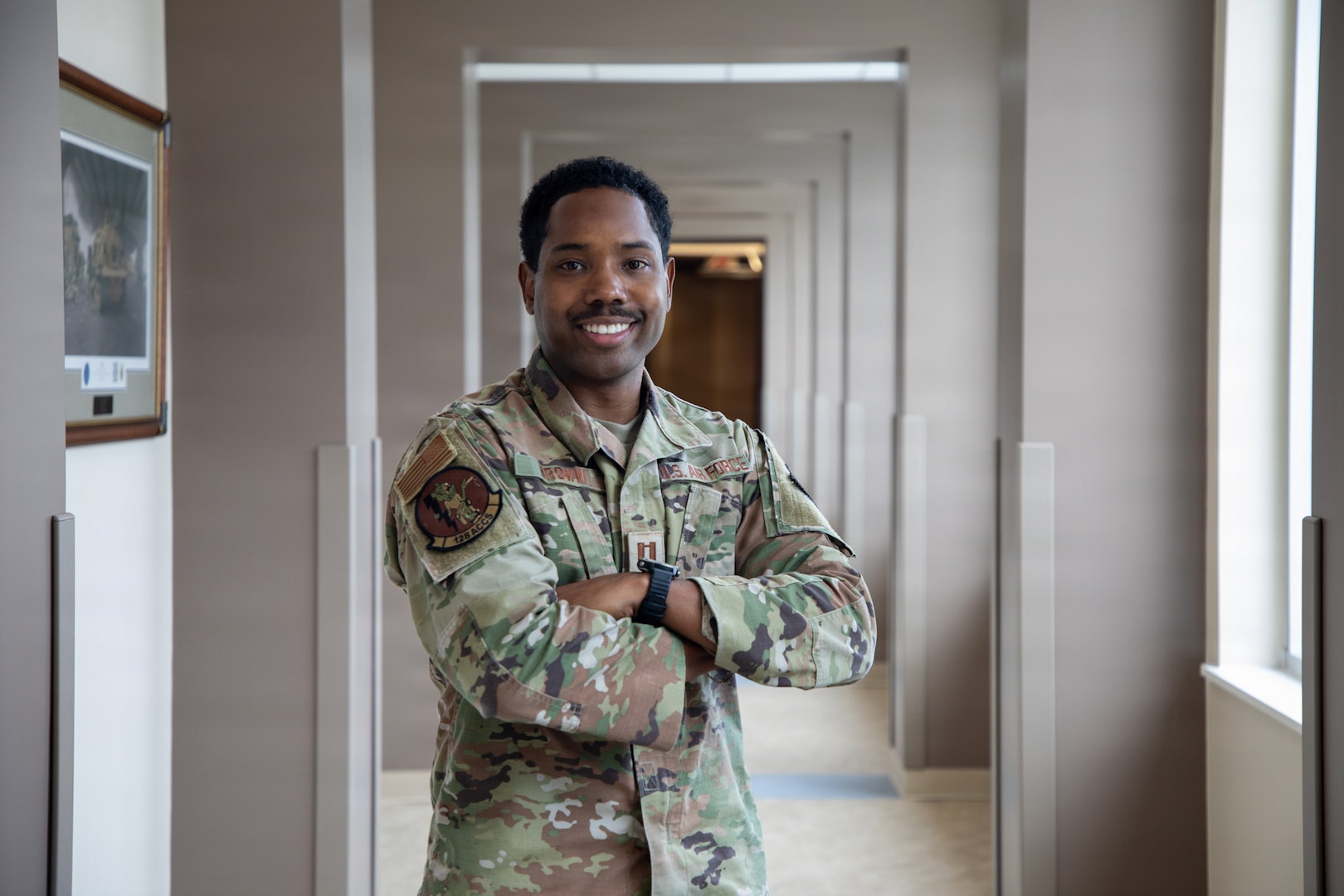 U.S. Air Force Capt. Dylan Brown, executive officer at headquarters of the Georgia Air National Guard, poses for a portrait inside the headquarters building at Clay National Guard Center, in Marietta, Georgia, Aug. 8, 2026. Brown was recently recognized as one of the University of Georgia's 40 Under 40 for his contributions to aviation, engineering and mentorship. (U.S. Air National Guard photo by Airmen First Class Kc Calhoun).