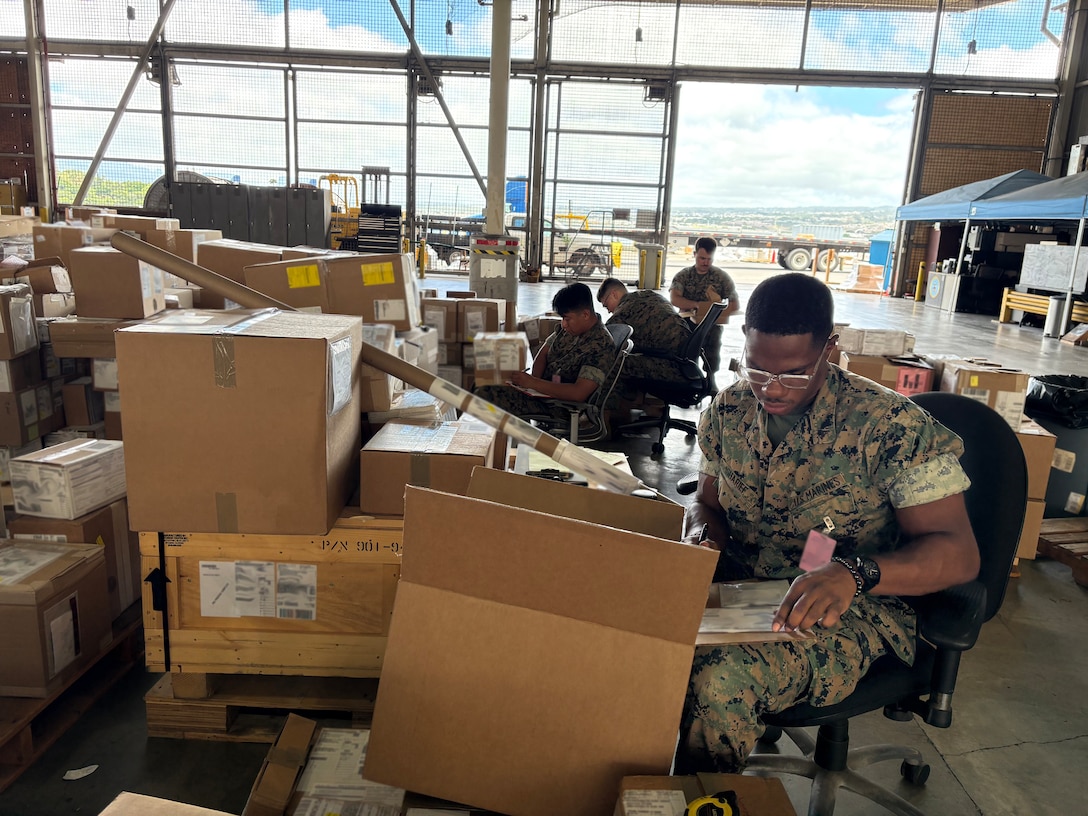 DLA Distribution employees working in a warehouse.