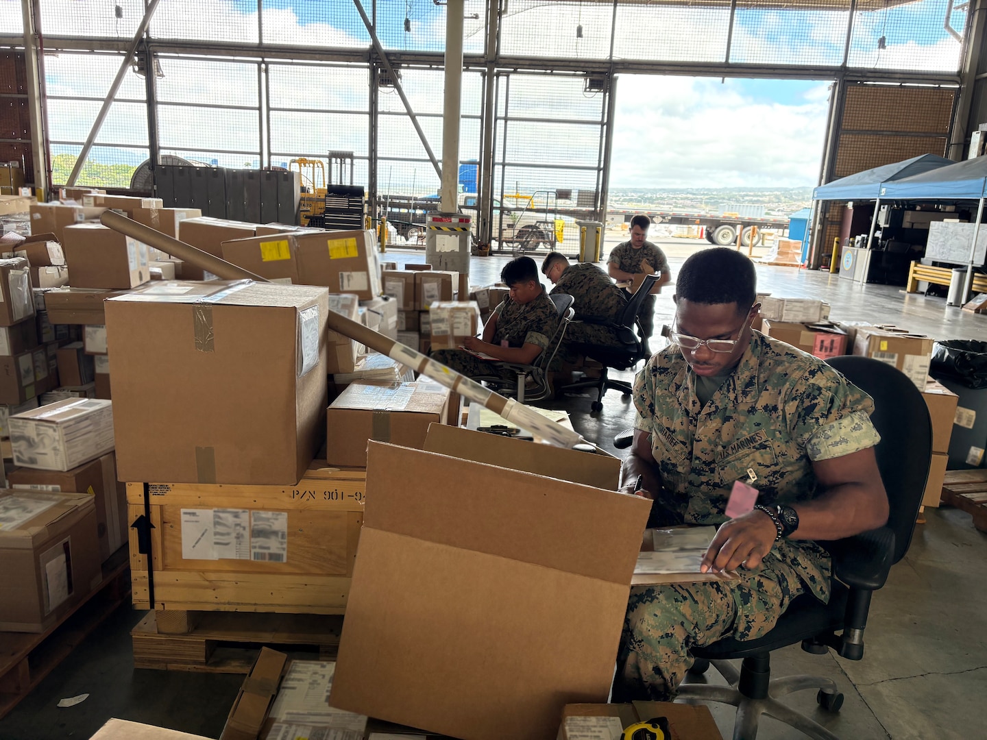 DLA Distribution employees working in a warehouse.