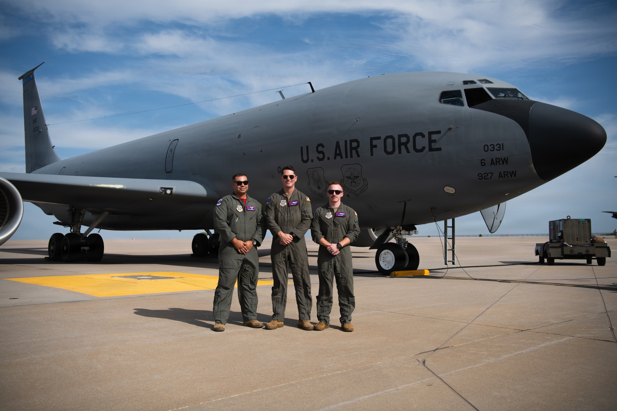 From left, U.S. Air Force Staff Sgt. Hector Agosto, 350th Air Refueling Squadron instructor boom operator, and Capt. Travis Simpson and Capt. Brad Keating, 350th ARS aircraft commanders, pose in front of a KC-135 Stratotanker at McConnell Air Force Base, Kansas, Aug. 14, 2026. The 350th crew delivered this KC-135 to Tinker Air Force Base, Oklahoma. (U.S. Air Force photo by Airman Matthew Nguyen)