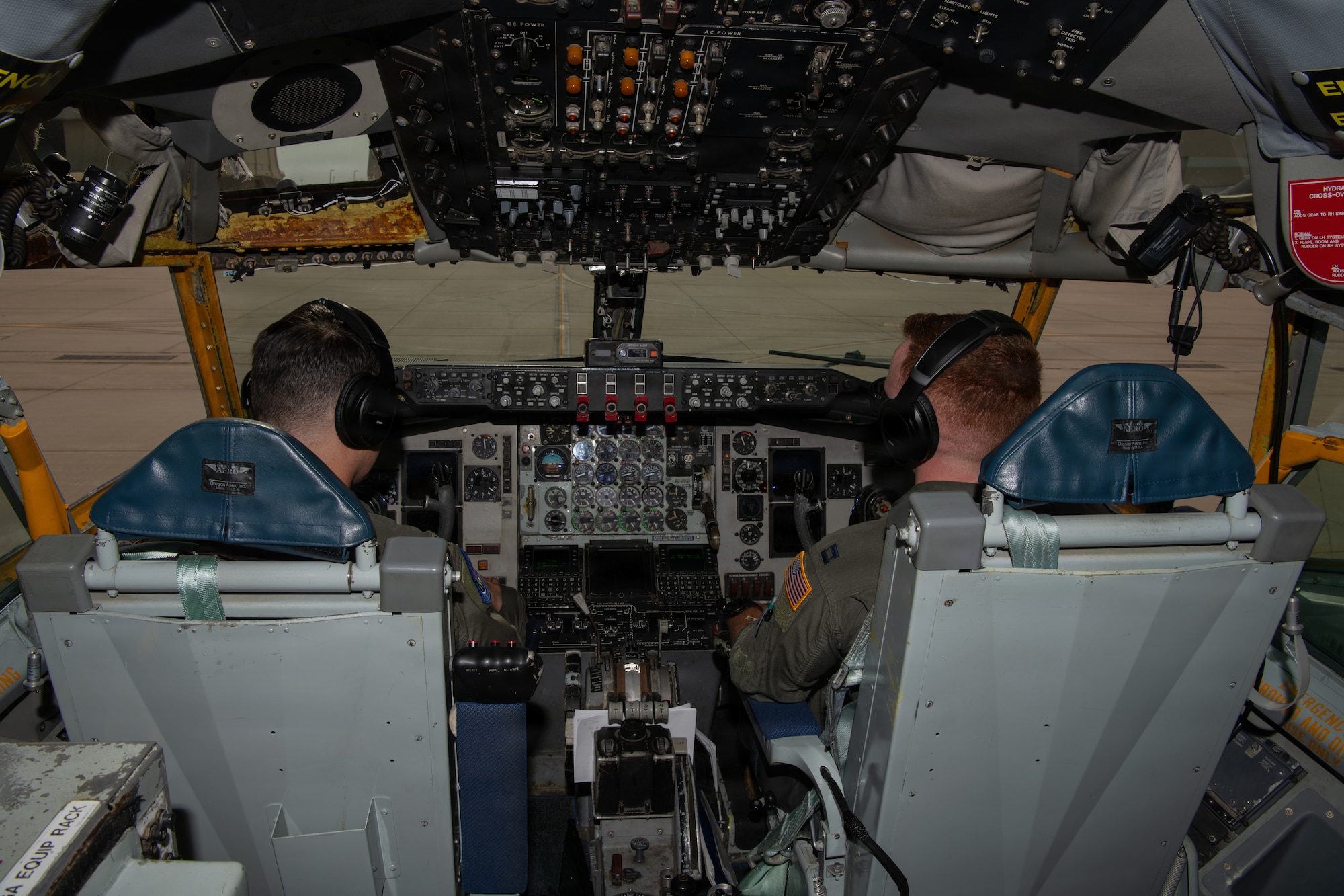 From left, U.S. Air Force Capt. Travis Simpson and Capt. Brad Keating, 350th Air Refueling Squadron aircraft commanders, prepare for a KC-135 Stratotanker departure at McConnell Air Force Base, Kansas, Aug. 14, 2026. The aircraft is part of McConnell AFB’s transition from the KC-135 Stratotanker to the KC-46A Pegasus. (U.S. Air Force photo by Airman Matthew Nguyen)