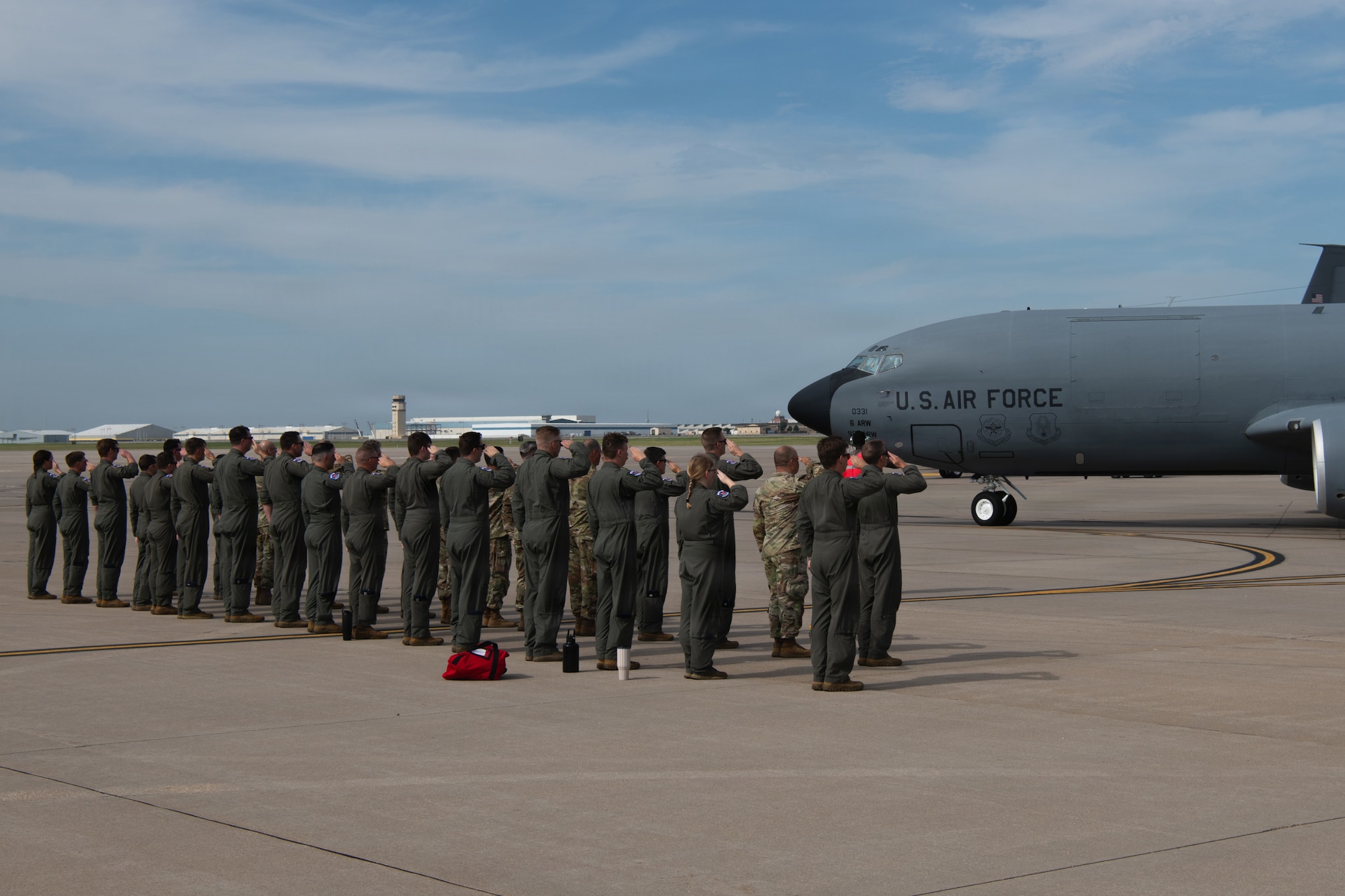 Members of the 350th Air Refueling Squadron salute a KC-135 Stratotanker as it taxis away for its final departure from McConnell Air Force Base, Kansas, Aug. 14, 2026. The departure marked a significant milestone in McConnell’s transition from the KC-135 to the KC-46A Pegasus, shifting the base’s aerial refueling mission entirely to the KC-46A Pegasus. (U.S. Air Force photo by Airman Matthew Nguyen)