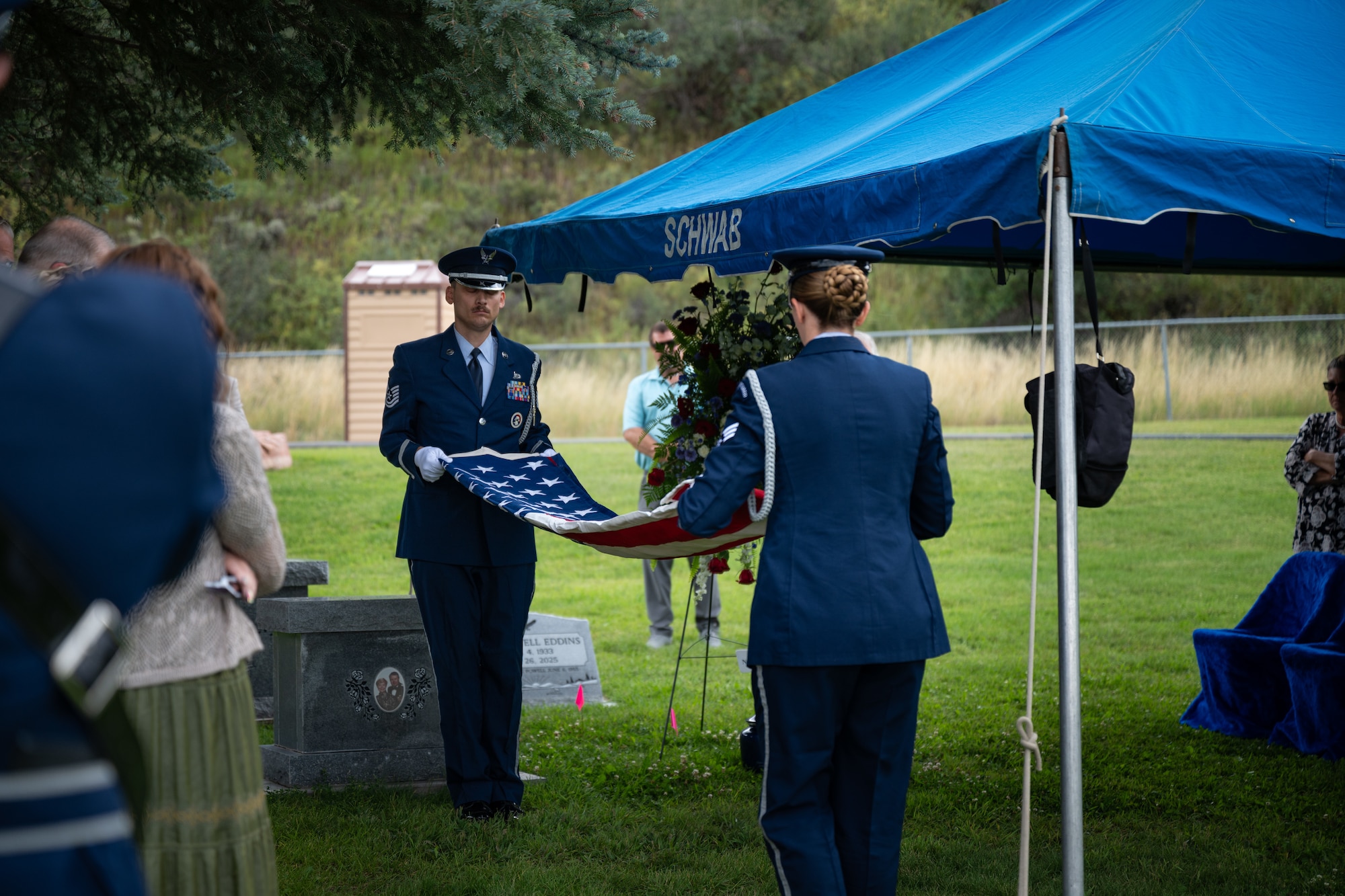A photo of three Air Force F-35A Lightning IIs rendering honors at a funeral by performing a missing man formation.
