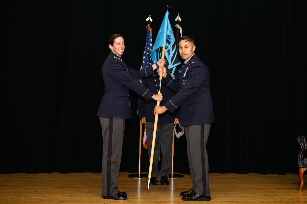 Space Training and Readiness Command, Space Delta 1 commander Col. Krista N. St. Romain (left) officiated the activation, formally passing the command guidon to the new U.S. Space Force’s 320th Recruiting Squadron commander Lt. Col. Jason Cano, during a ceremony Aug. 14 at the Parr Club. The moment marked a decisive step in shaping the force needed for tomorrow’s space mission.