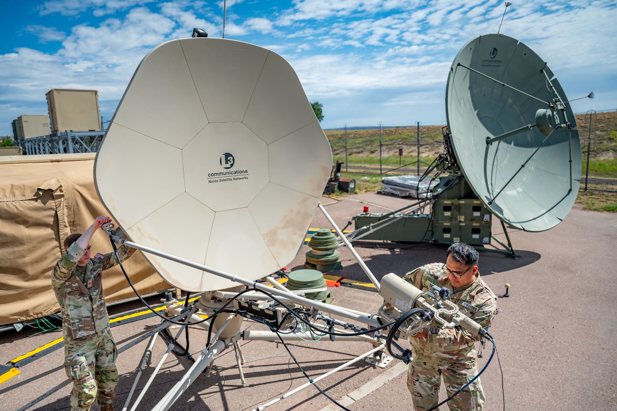 Mission Delta 3 Guardians sharpen their tactical edge on the Ground Multi-band Terminal (GMT) and Quad-band Large Aperture Antenna (QLAA) at Peterson Space Force Base, Colorado, July 27, 2026. These highly deployable systems provide the critical, multi-band SATCOM links that power joint operations worldwide. By running live electronic warfare scenarios on the GMT and QLAA, Guardians train to detect, identify, and defeat simulated adversary jamming in real-time. This realistic, contested-environment training ensures operators are combat-ready, without disrupting real-world communications. (U.S. Space Force photo by Dave Grim)