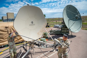 Mission Delta 3 Guardians sharpen their tactical edge on the Ground Multi-band Terminal (GMT) and Quad-band Large Aperture Antenna (QLAA) at Peterson Space Force Base, Colorado, July 27, 2026. These highly deployable systems provide the critical, multi-band SATCOM links that power joint operations worldwide. By running live electronic warfare scenarios on the GMT and QLAA, Guardians train to detect, identify, and defeat simulated adversary jamming in real-time. This realistic, contested-environment training ensures operators are combat-ready, without disrupting real-world communications. (U.S. Space Force photo by Dave Grim)