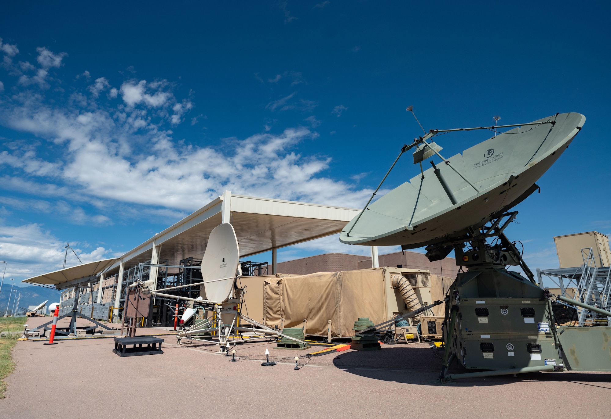 Mission Delta 3 Guardians sharpen their tactical edge on the Ground Multi-band Terminal (GMT) and Quad-band Large Aperture Antenna (QLAA) at Peterson Space Force Base, Colorado, July 27, 2026. These highly deployable systems provide the critical, multi-band SATCOM links that power joint operations worldwide. By running live electronic warfare scenarios on the GMT and QLAA, Guardians train to detect, identify, and defeat simulated adversary jamming in real-time. This realistic, contested-environment training ensures operators are combat-ready, without disrupting real-world communications. (U.S. Space Force photo by Dave Grim)