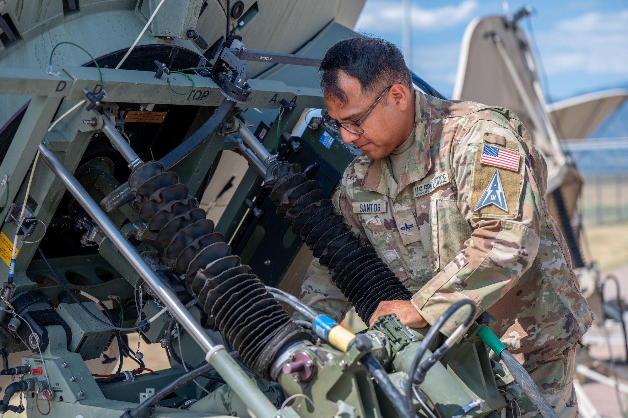 Mission Delta 3 Guardians sharpen their tactical edge on the Ground Multi-band Terminal (GMT) and Quad-band Large Aperture Antenna (QLAA) at Peterson Space Force Base, Colorado, July 27, 2026. These highly deployable systems provide the critical, multi-band SATCOM links that power joint operations worldwide. By running live electronic warfare scenarios on the GMT and QLAA, Guardians train to detect, identify, and defeat simulated adversary jamming in real-time. This realistic, contested-environment training ensures operators are combat-ready, without disrupting real-world communications. (U.S. Space Force photo by Dave Grim)