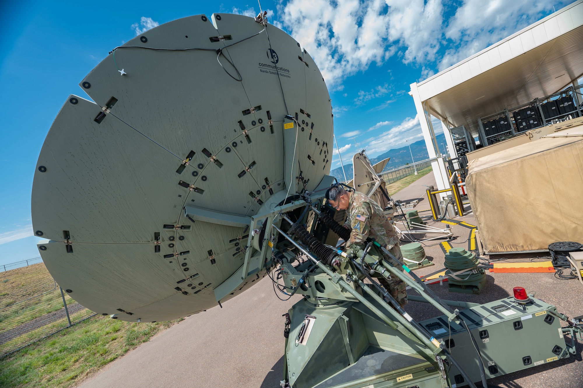 Mission Delta 3 Guardians sharpen their tactical edge on the Ground Multi-band Terminal (GMT) and Quad-band Large Aperture Antenna (QLAA) at Peterson Space Force Base, Colorado, July 27, 2026. These highly deployable systems provide the critical, multi-band SATCOM links that power joint operations worldwide. By running live electronic warfare scenarios on the GMT and QLAA, Guardians train to detect, identify, and defeat simulated adversary jamming in real-time. This realistic, contested-environment training ensures operators are combat-ready, without disrupting real-world communications. (U.S. Space Force photo by Dave Grim)