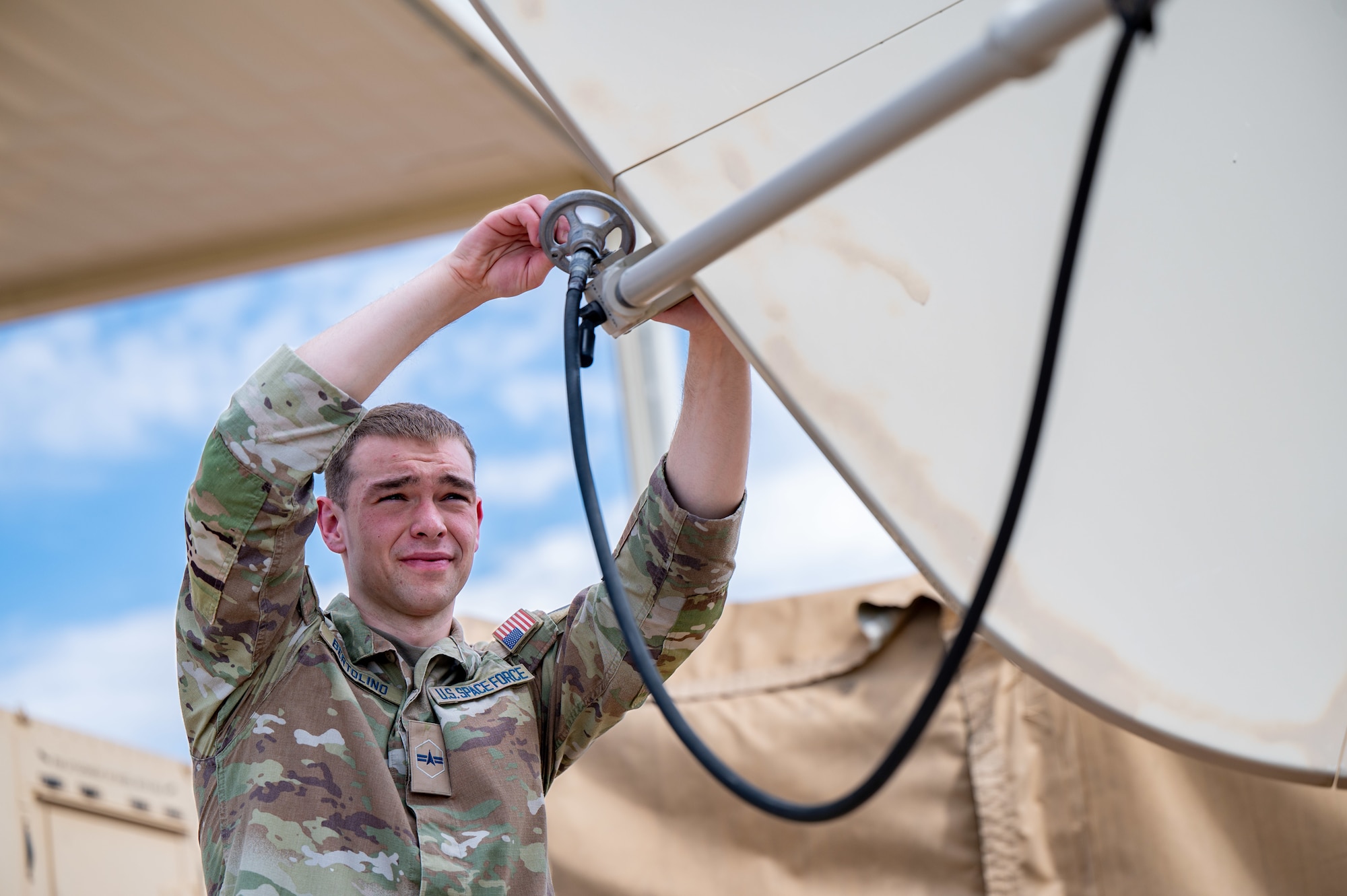 Mission Delta 3 Guardians sharpen their tactical edge on the Ground Multi-band Terminal (GMT) and Quad-band Large Aperture Antenna (QLAA) at Peterson Space Force Base, Colorado, July 27, 2026. These highly deployable systems provide the critical, multi-band SATCOM links that power joint operations worldwide. By running live electronic warfare scenarios on the GMT and QLAA, Guardians train to detect, identify, and defeat simulated adversary jamming in real-time. This realistic, contested-environment training ensures operators are combat-ready, without disrupting real-world communications. (U.S. Space Force photo by Dave Grim)
