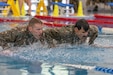 Army Reserve Capt. Brandon Walp, 377th Theater Sustainment Command, and Air Force Reserve Lt. Col. Daniel Montilla, 954th Reserve Support Squadron, climb over an obstacle during the swim obstacle course event August 6, 2026 near Bucharest, Romania. Reserve Airmen and Soldiers compete against 13 nations during the Interallied Confederation of Reserve Officers Military Competition (CIOR MILCOMP) a three-day team competition consisting of NATO and Partnership for Peace nations, held this year in Romania. (U.S. Army photo by Calvin Reimold)