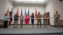 Pictured left to right: Nancy Maloy, NSWC Crane Platform Protection & Countermeasures Technologies Division Manager, Marty Terry, NSWC Crane Countermeasures Assessment Branch Manager, Brigadier General Cathy Eaken, Congresswoman Erin Houchin, Dr. Angela Lewis (SES), Technical Director, NSWC Crane, COL Russell “Bubba” Strange, COL Daniel Bell, and Command Sgt Maj. Brad Simmons at the ribbon cutting for the nation’s first ground-based Sled Track Facility at Camp Atterbury in Indiana.