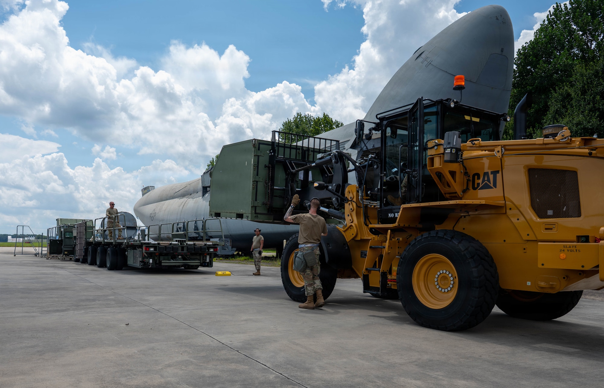 Airmen load a cargo palette