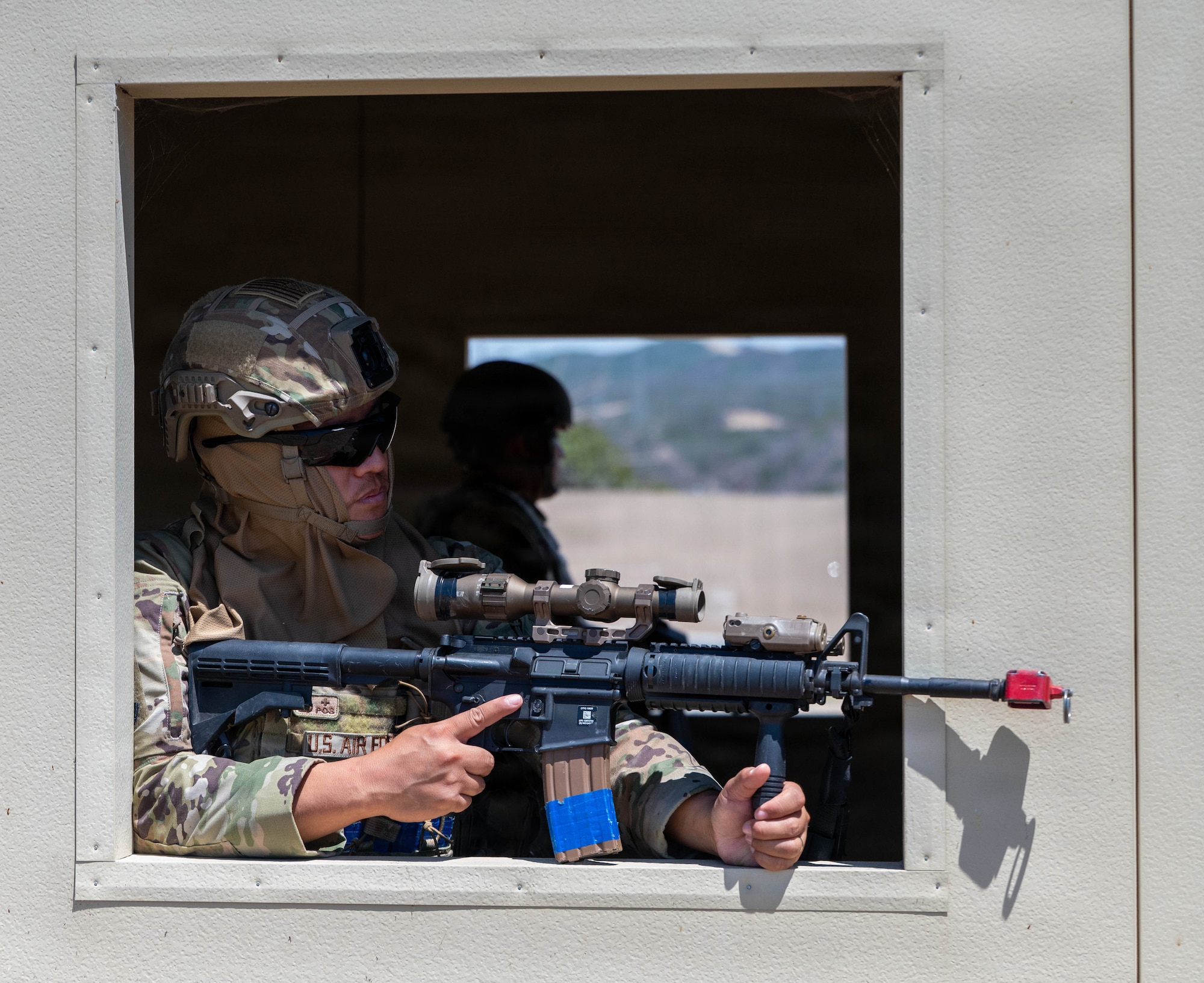 Defender aims weapon out of window