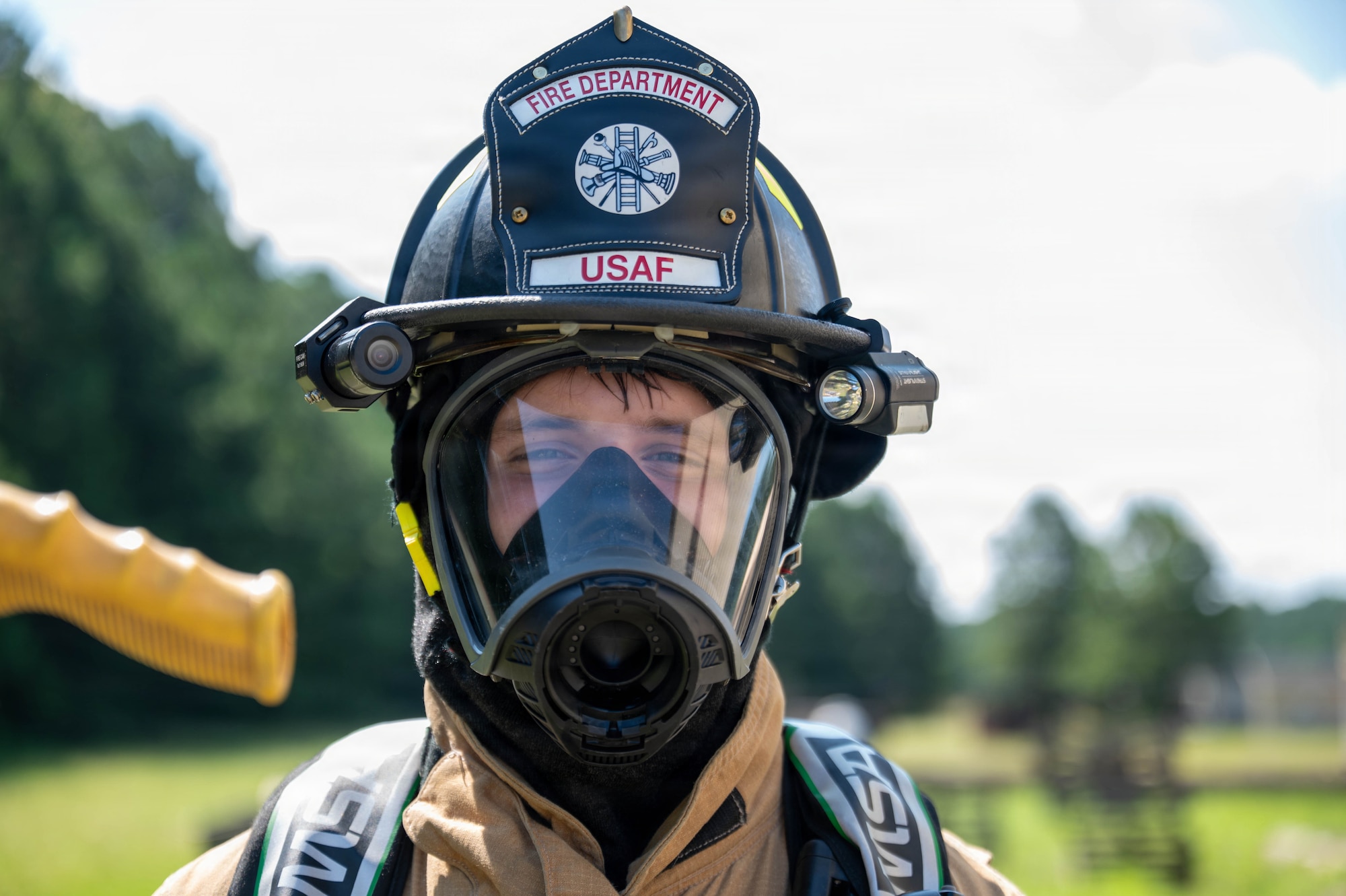 firefighter stands in his gear