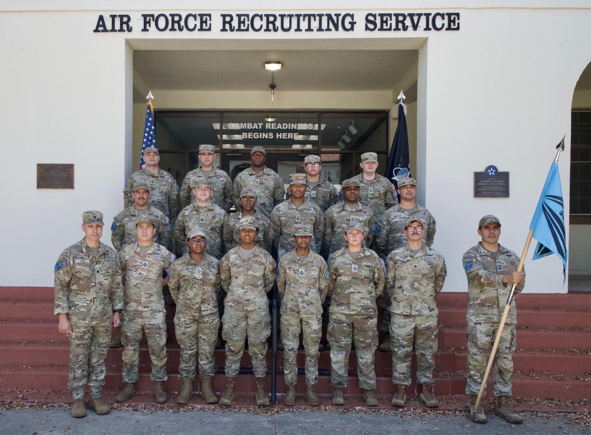 U.S. Space Force recruiters from the 320th Recruiting Squadron (RCS) pose for a group photo at Joint Base San Antonio-Randolph, Texas, Aug. 18, 2026. The 320 RCS was activated on Aug. 14, as the Space Force’s first dedicated recruiting squadron and the home of the Guardian Talent Scout (GTS) program. The recruiters are standing in front of the Air Force HQ Recruiting Service building. (U.S. Air Force photo by Olivia Mendoza Sencalar)