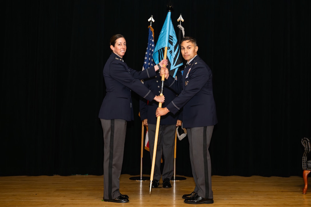 Space Training and Readiness Command, Space Delta 1 commander Col. Krista N. St. Romain (left) officiated the activation, formally passing the command guidon to the new U.S. Space Force’s 320th Recruiting Squadron commander Lt. Col. Jason Cano, during a ceremony Aug. 14 at the Parr Club. The moment marked a decisive step in shaping the force needed for tomorrow’s space mission.