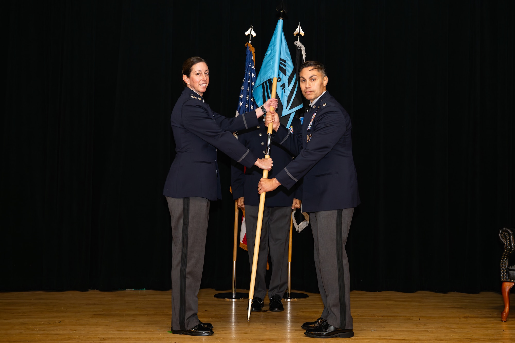 Space Training and Readiness Command, Space Delta 1 commander Col. Krista N. St. Romain (left) officiated the activation, formally passing the command guidon to the new U.S. Space Force’s 320th Recruiting Squadron commander Lt. Col. Jason Cano, during a ceremony Aug. 14 at the Parr Club. The moment marked a decisive step in shaping the force needed for tomorrow’s space mission.