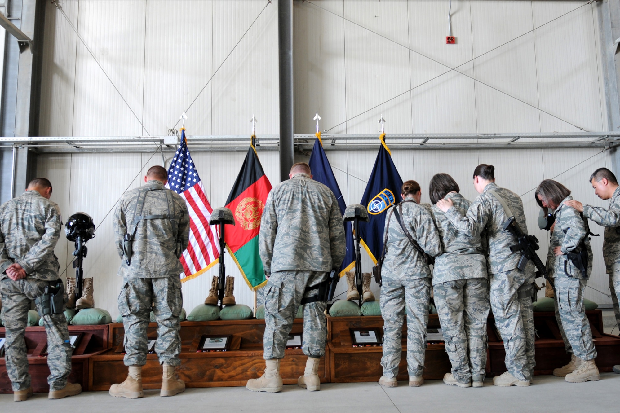 Airmen pay their respects to the “NATC-A Nine,” Air Advisor colleagues killed at Kabul International Airport, 2011.