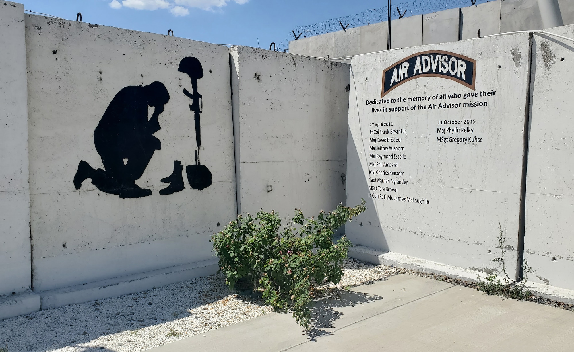 Air Advisor memorial wall at Forward Operating Base Oqab (Eagle), Kabul International Airport. The wall protected a courtyard used for ceremonies and recreation.