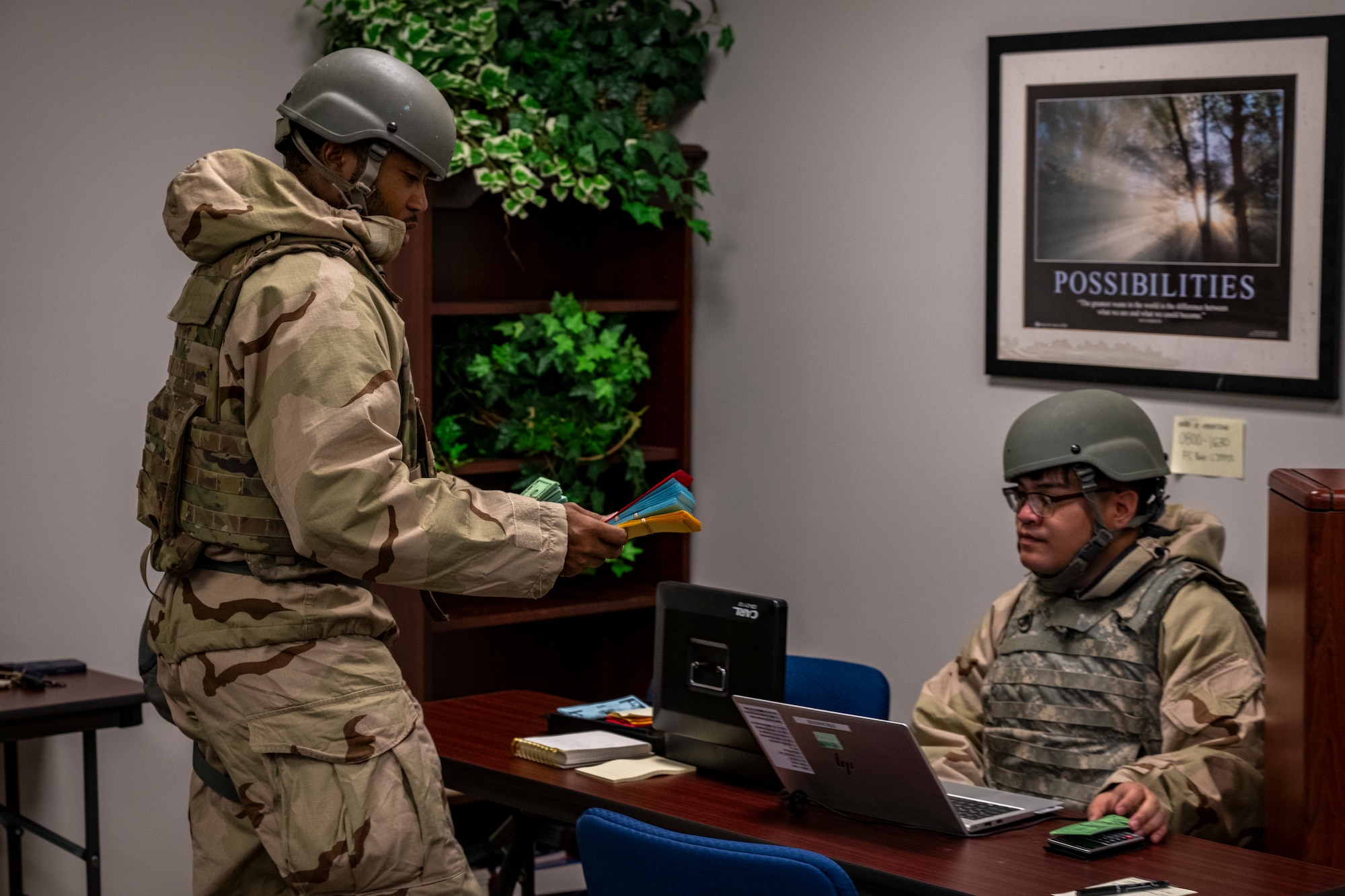 Airmen conduct a simulated financial transaction during exercise