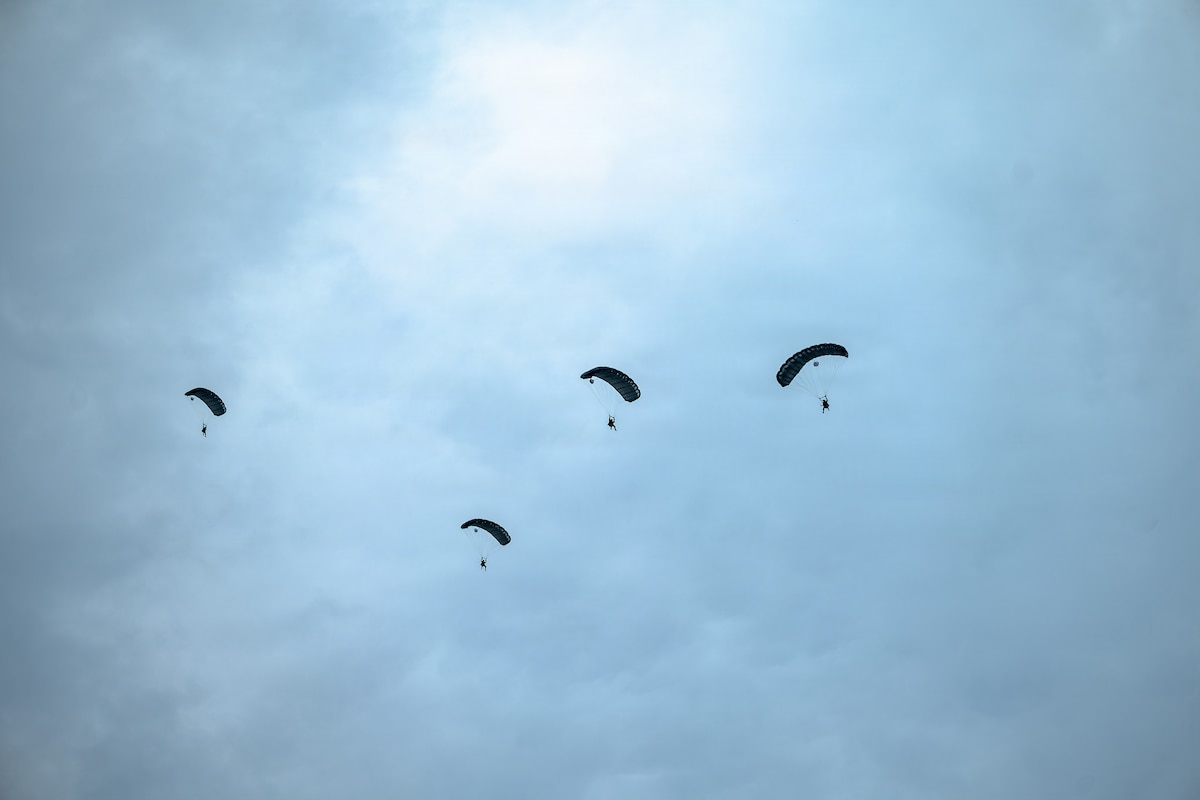 U.S. Soldiers assigned to the 824th Quartermaster Company conduct a static-line jump over Alpena, Michigan, Aug. 9, 2026, during Northern Strike 26-2. The Army-sponsored, multinational exercise provides joint and partner forces opportunities to train in a realistic, multi-domain environment at Michigan's National All-Domain Warfighting Center. (U.S. Air Force photo by Senior Airman Raul Mercado)
