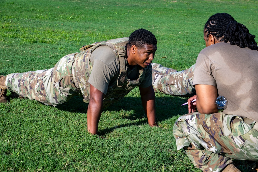Airman performs pushups during a combat fitness test