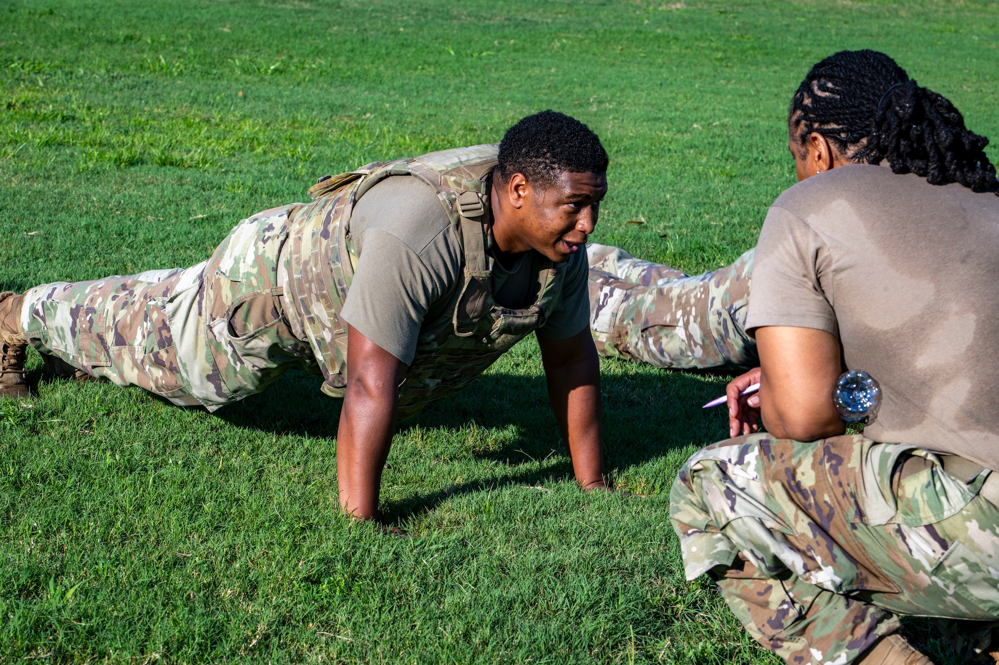 Airman performs pushups during a combat fitness test
