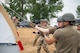 5th Comptroller Squadron Airmen raise a tent.