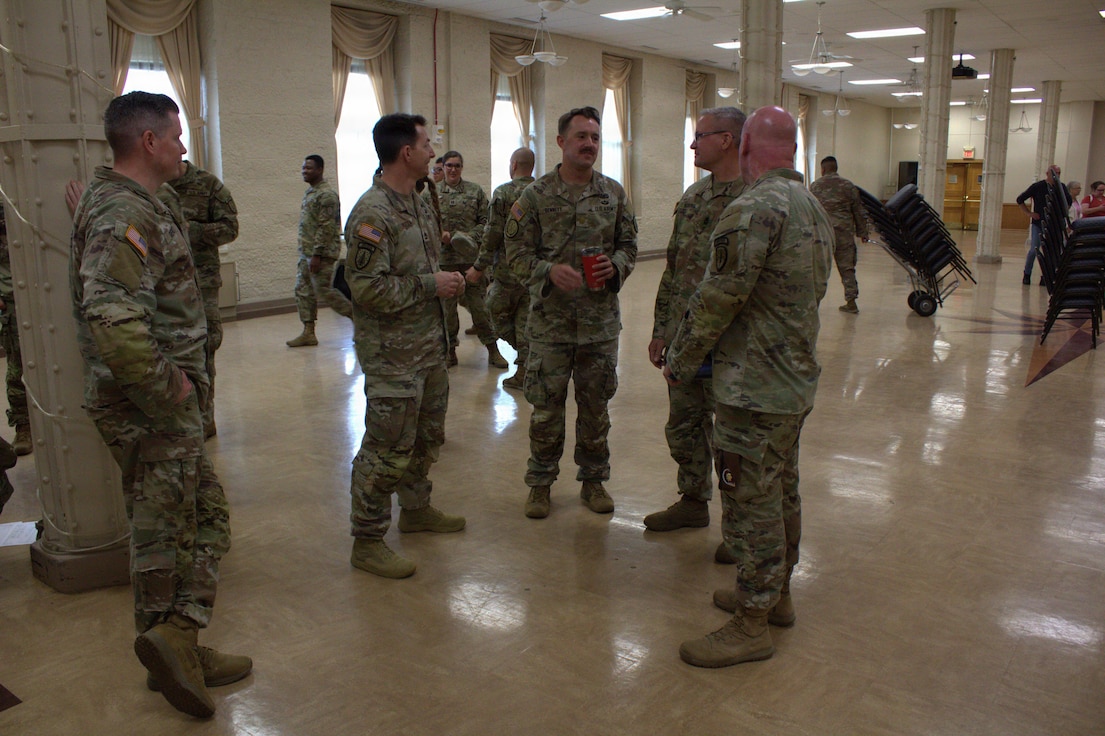Soldiers of the Illinois Army National Guard socialize after the conclusion of the welcome home ceremony