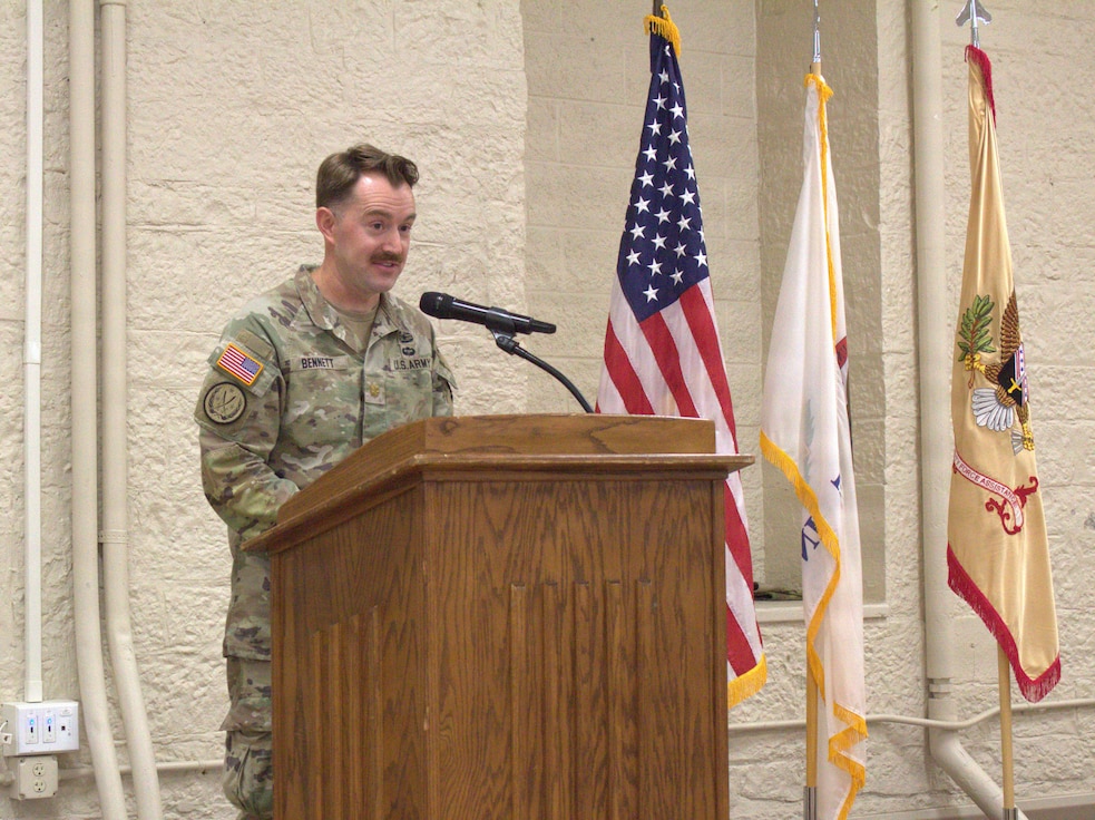 Maj. Micah Bennet, team leader for logistics company advisor team (LCAT) 6640, 6th Battalion, 54th Security Force Assistance Brigade, Illinois Army National Guard, speaks during at the welcome home ceremony