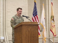 Maj. Micah Bennet, team leader for logistics company advisor team (LCAT) 6640, 6th Battalion, 54th Security Force Assistance Brigade, Illinois Army National Guard, speaks during at the welcome home ceremony