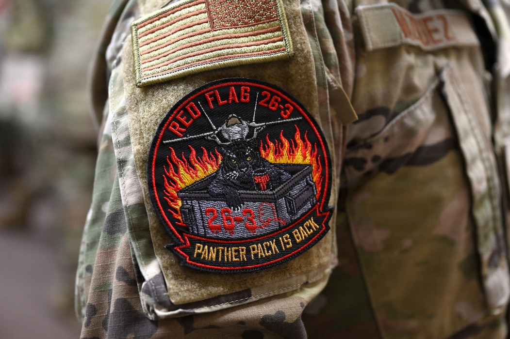 A U.S Airman assigned to the 35th Fighter Wing at Misawa Air Base, Japan, wears a RED FLAG-Alaska 26-3 patch while participating in the exercise at Eielson Air Force Base, Alaska, Aug. 14, 2026.