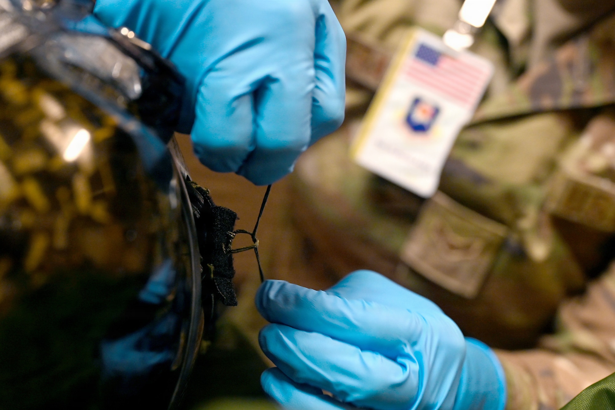 U.S. Air Force Airman 1st Class Gabrielle Devera, 35th Operations Support Squadron aircrew flight equipment specialist, repairs a component of a flight helmet during RED FLAG-Alaska 26-3 at Eielson Air Force Base, Alaska, Aug. 17, 2026.