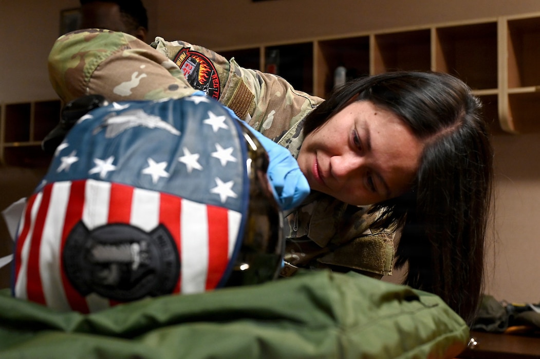 U.S. Air Force Airman 1st Class Gabrielle Devera, 35th Operations Support Squadron aircrew flight equipment specialist, repairs a component of a flight helmet during RED FLAG-Alaska 26-3 at Eielson Air Force Base, Alaska, Aug. 17, 2026.